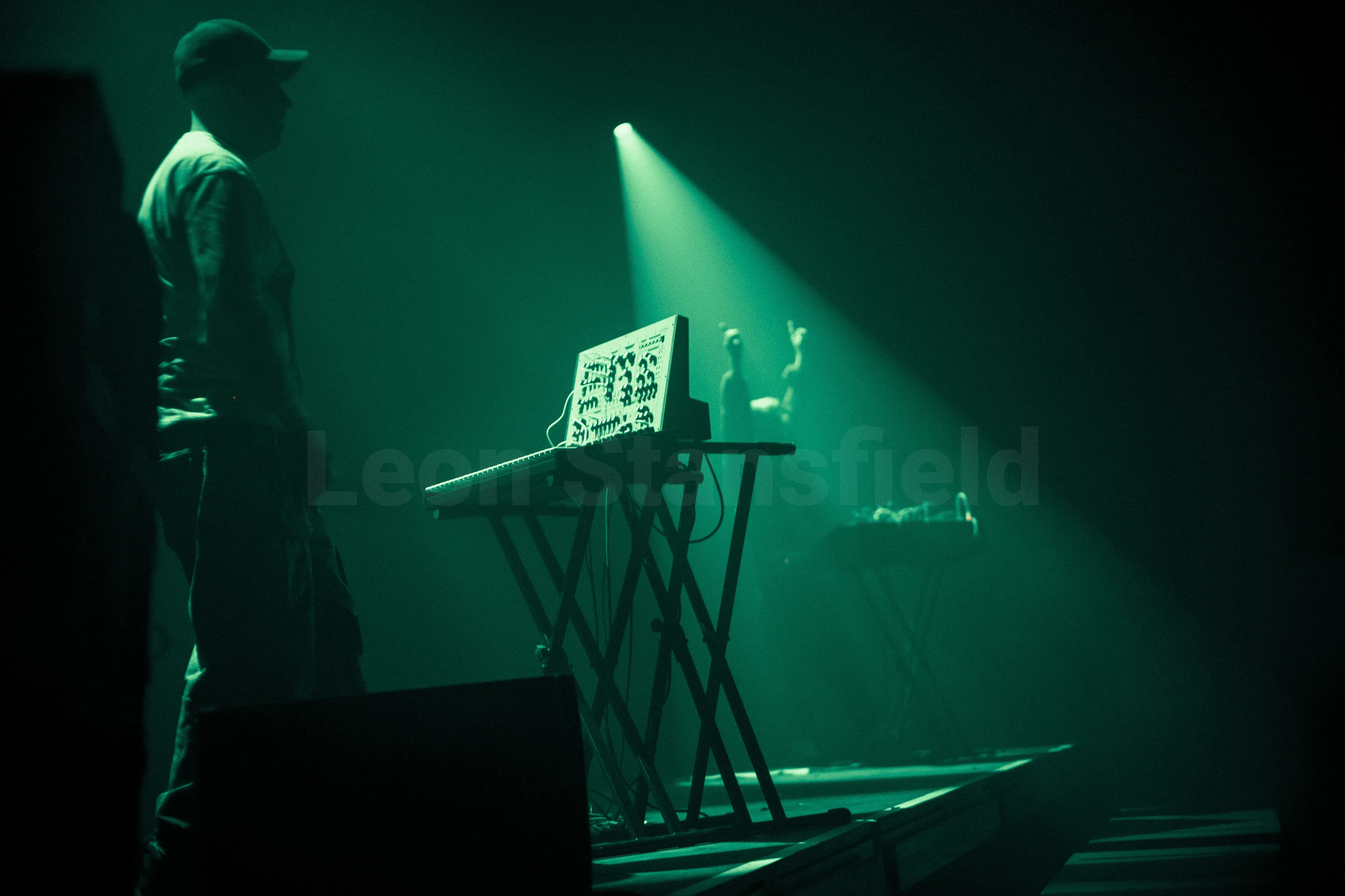 A photo of a DJ playing in a nightclub